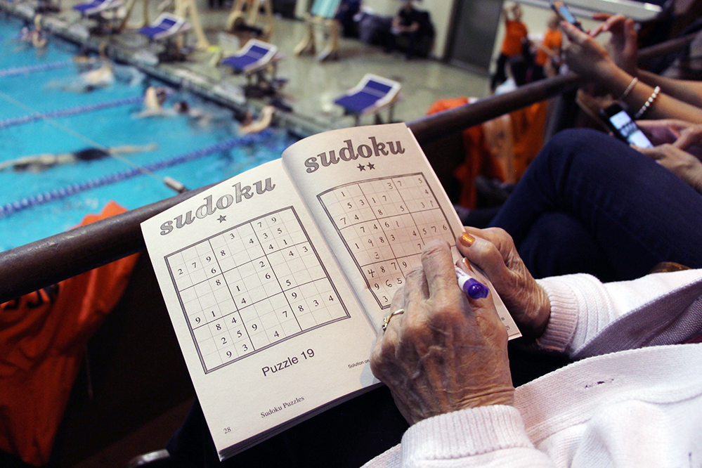 Nana Playing Soduku at the Swim Meet