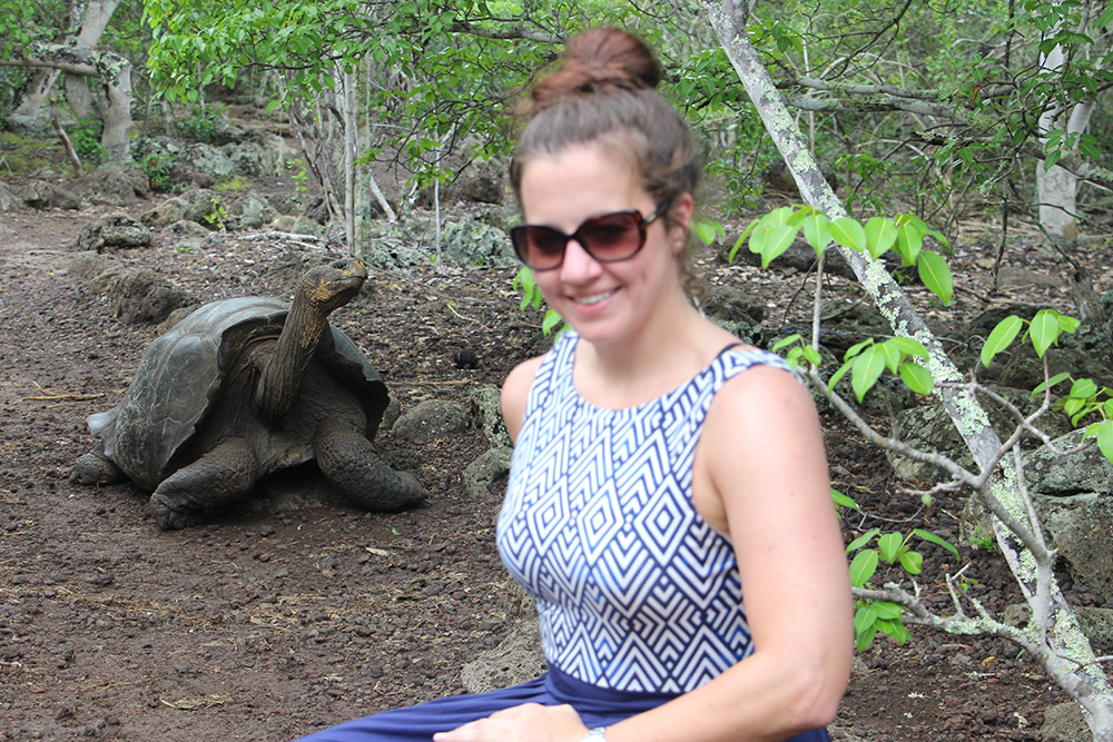 Posing with a Galapagos Giant Tortoise