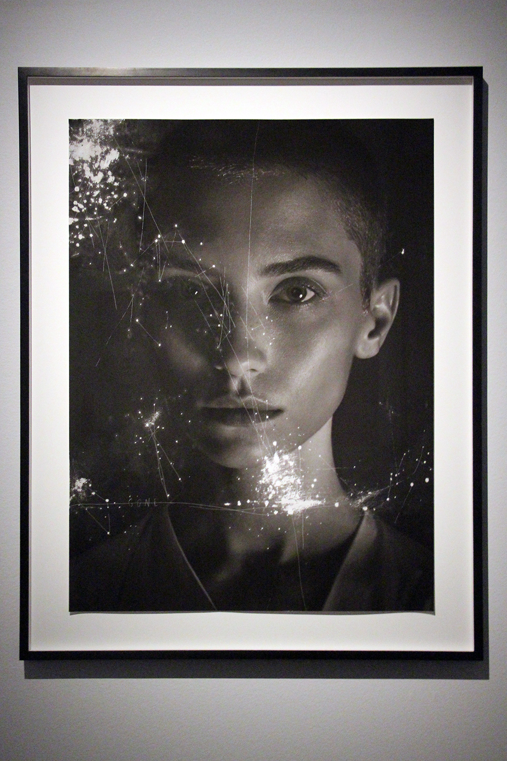 Woman in the Berning and Di Battista Confluence Exhibit at the Fotografiska Museum in Stockholm