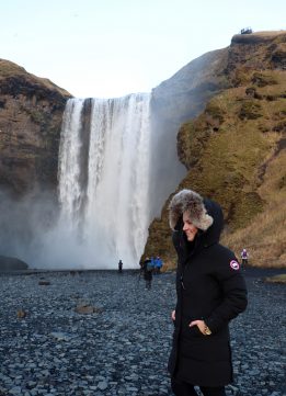 Iceland Waterfalls - Kelly at the Base of the Skógafoss Waterfall