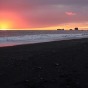 Glowing Sunset at Reynisfjara Black Sand Beach in Vik Iceland