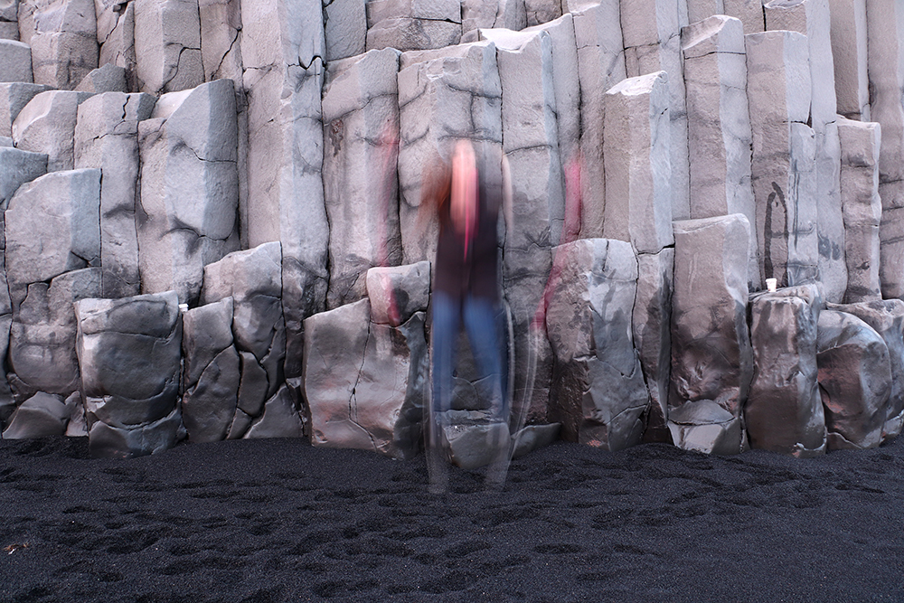 Kelly Jumping at the Reynisfjara Black Sand Beach in Vik Iceland