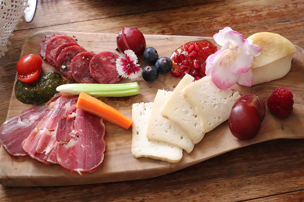 Traditional Portuguese food platter with meat and cheese