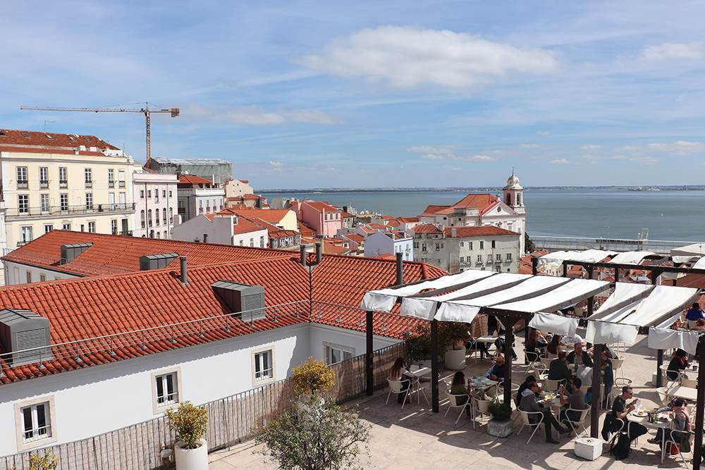 Panoramic view of red rooftops in Alfama district Lisbon Portugal