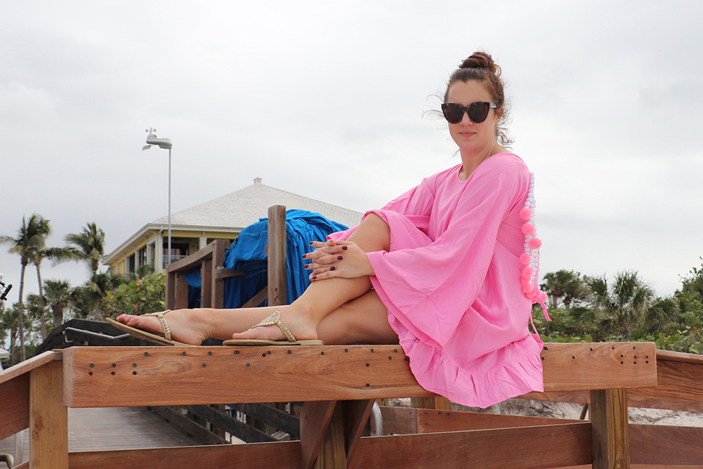 Wearing Sundress Fiorella Dress with Pom-Poms at Barefoot Beach