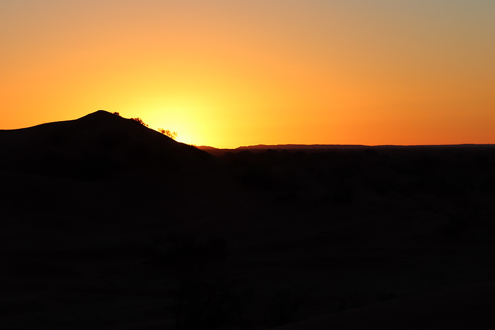 Camping in the Sahara - Start of Sunrise Over the Dunes