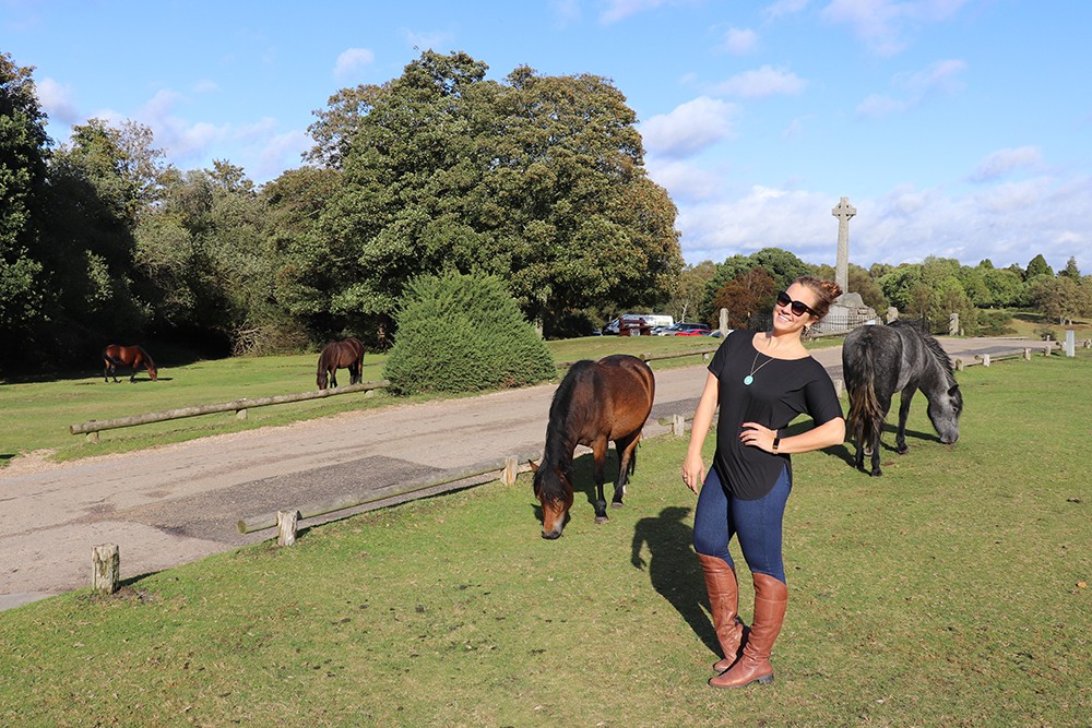 Travel Blogger Kelly Donlin with Wild Horses in the New Forest