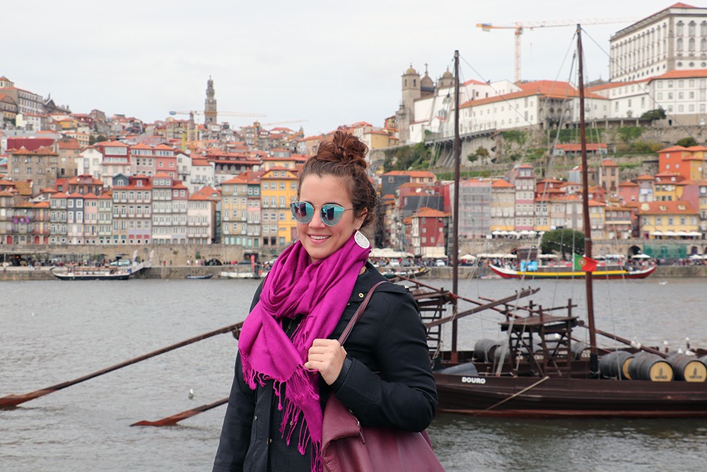 Travel Blogger Kelly Sparkles and Shoes with the Cais da Ribeira in Porto Portugal