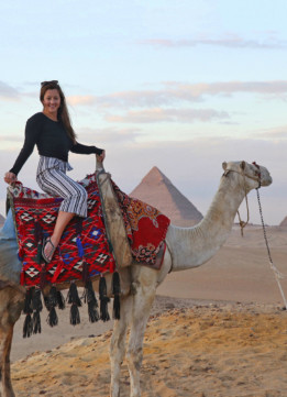 Travel Blogger Kelly Donlin at the Great Pyramids in Giza Egypt