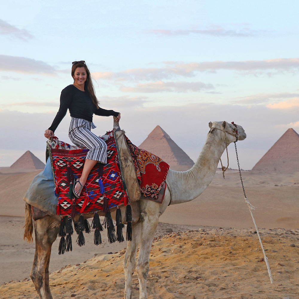Travel Blogger Kelly Donlin at the Great Pyramids in Giza Egypt