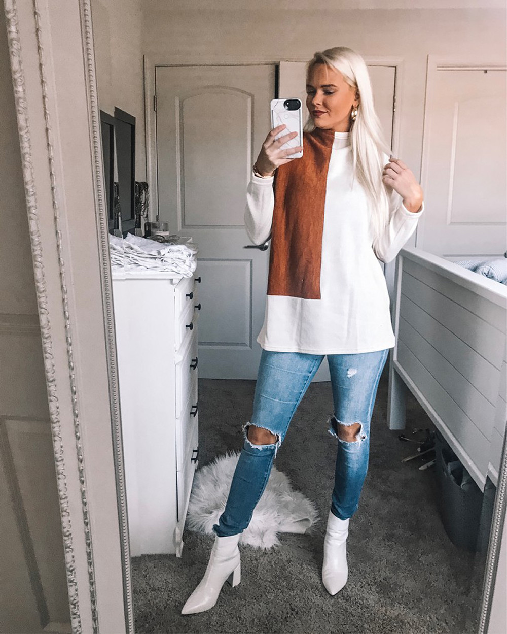 Nikki of xoxohnw with Sweater and White Boots