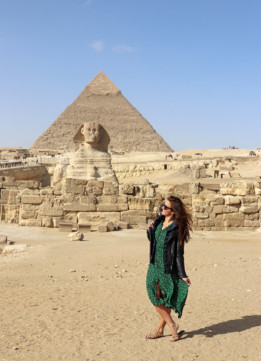 Travel Blogger Kelly Donlin with the Great Sphinx of Giza and the Egyptians Pyramids