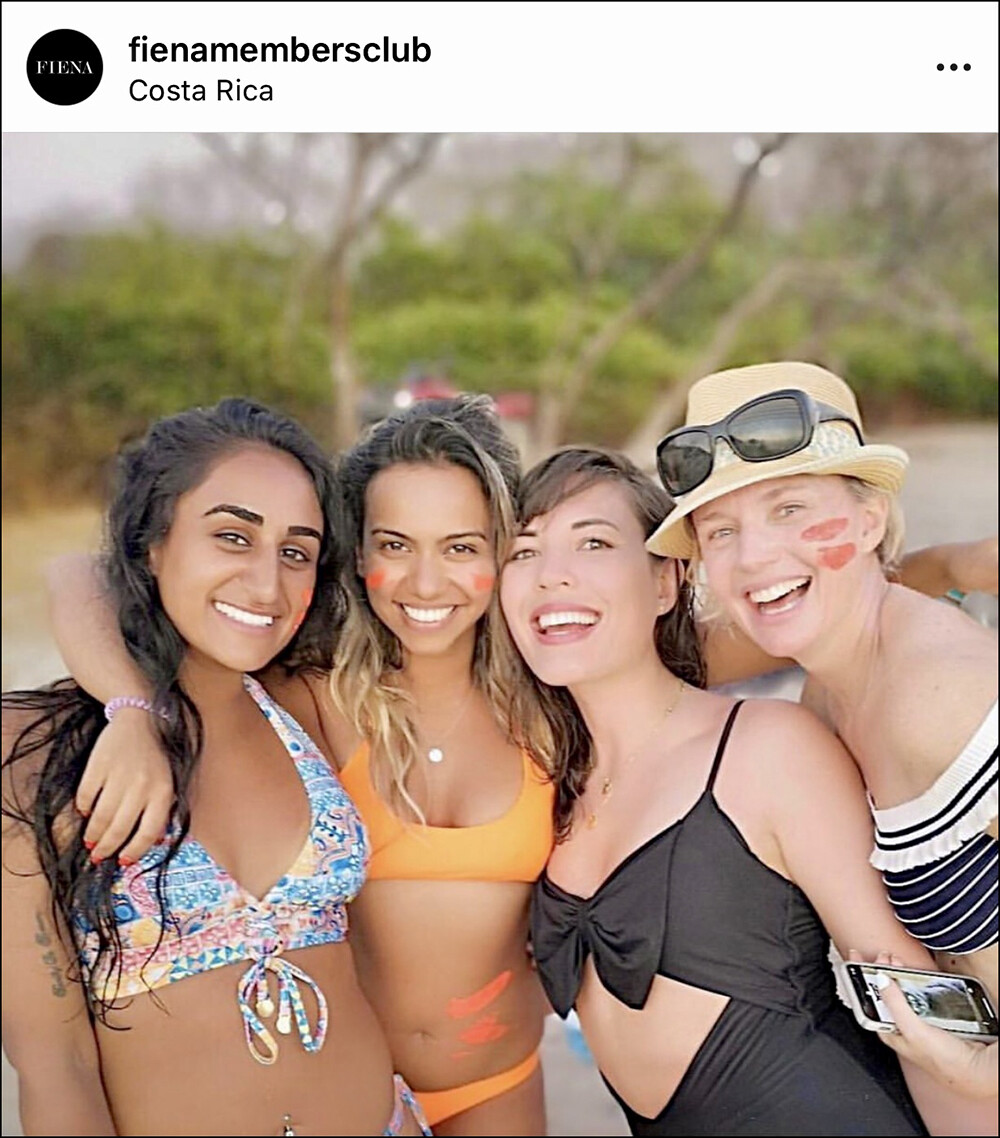 Fiena Members Club - Group shot in Costa Rica during a bonfire night on the beach