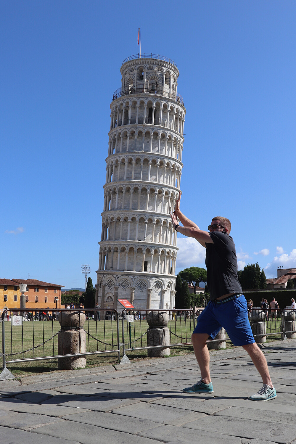 Mark holding up the Leaning Tower of Pisa