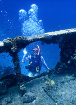 Travel Blogger through the Porthole of the Lesleen M Wreck