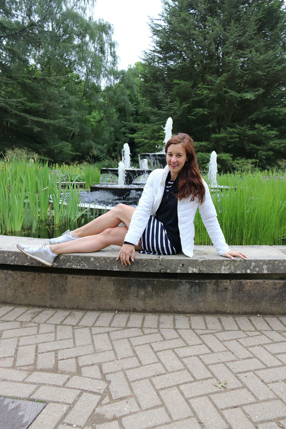 Rainy Weather Outfit - UK Fashion Blogger in Waterproof Puffer Jacket, striped dress, and LK Bennett Metallic Trainers