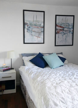 Guest Room with Watercolor Harbor Study I and Watercolor Harbor Study II from Photowall over Bed