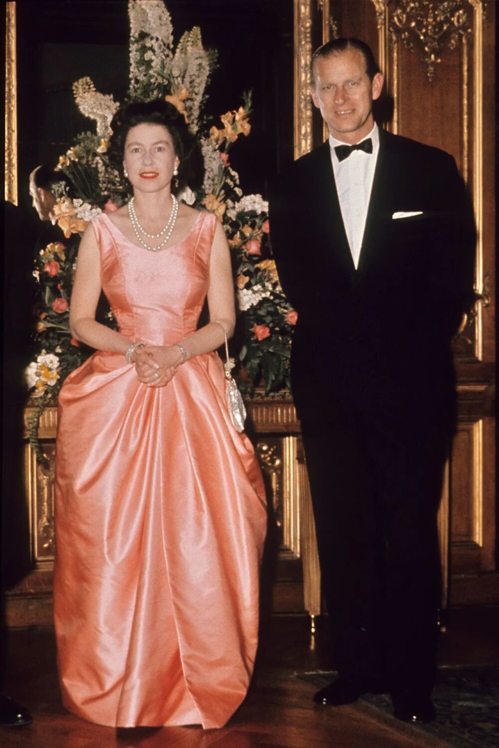 1963 - coral evening gown with her signature pearls - PA