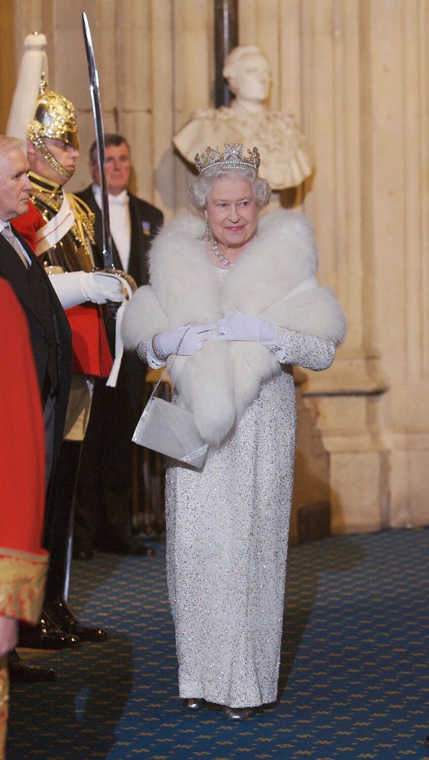 2006 - a white beaded gown with a fur stole at the State Opening of Parliament - Anwar Hussein Collection