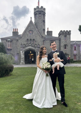The Bride and Groom with the Flower Girl at Whitby Castle in Rye New York