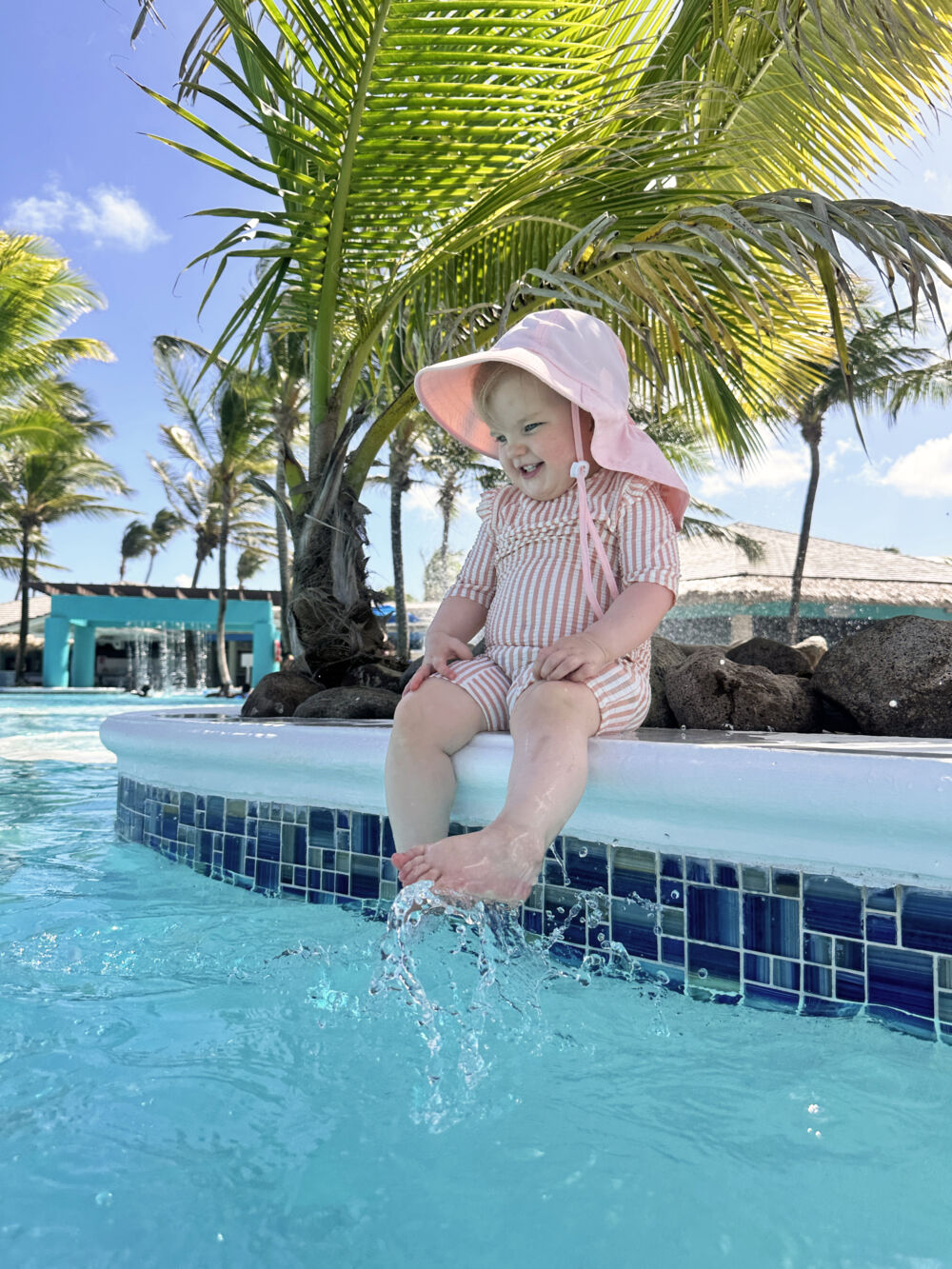 Snapshots from St. Lucia - Lily wearing H&M Swimsuit UPF 50 in pink stripes and Zelda Matilda UPF 50 Toddler Sun Hat