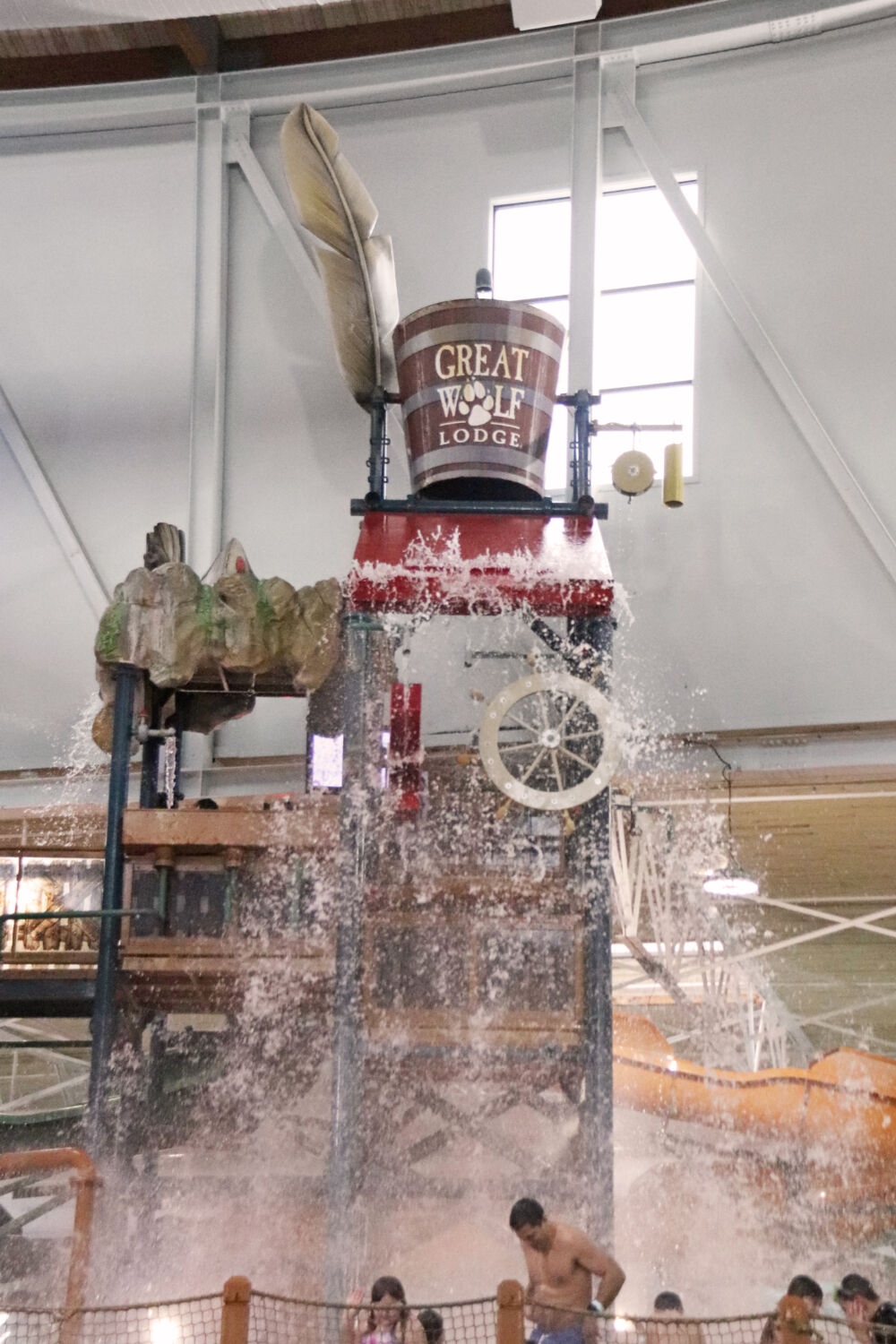 The iconic giant Great Wolf Lodge water bucket tipping over and splashing guests.