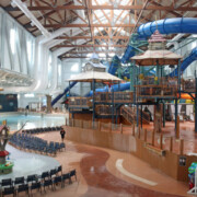 A wide-angle view of the massive indoor waterpark at Great Wolf Lodge Poconos, showing various slides and pools.