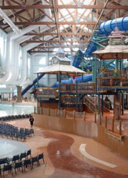 A wide-angle view of the massive indoor waterpark at Great Wolf Lodge Poconos, showing various slides and pools.