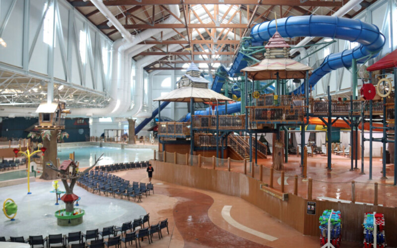 A wide-angle view of the massive indoor waterpark at Great Wolf Lodge Poconos, showing various slides and pools.