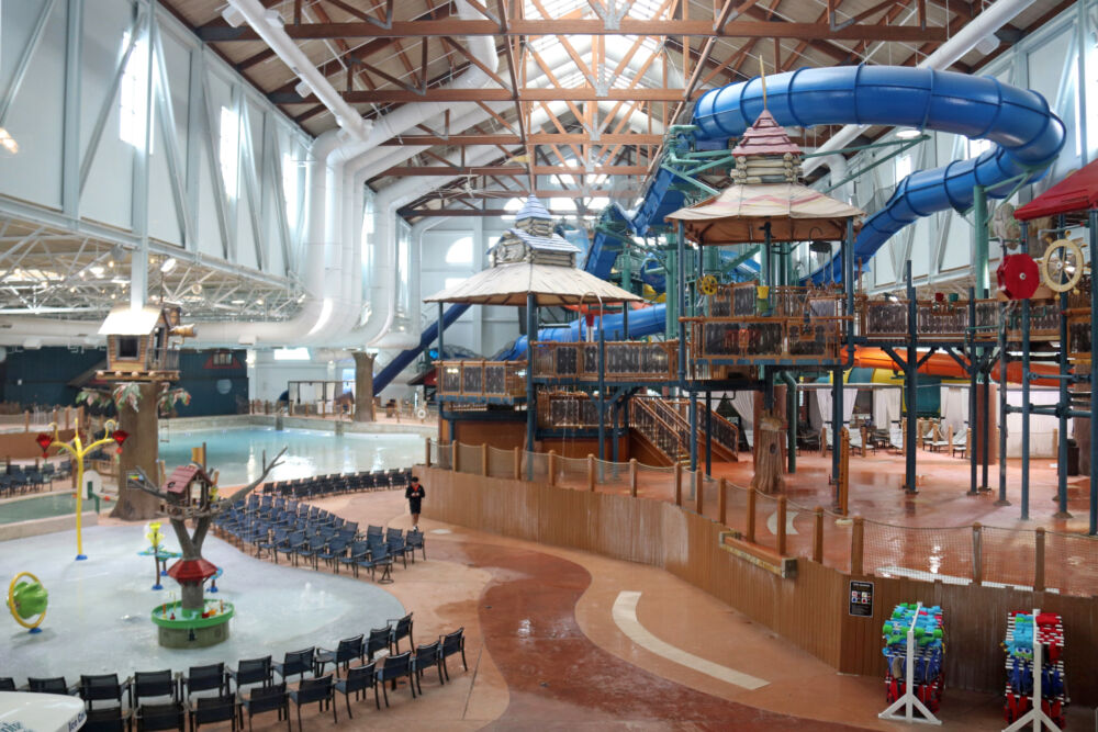 A wide-angle view of the massive indoor waterpark at Great Wolf Lodge Poconos, showing various slides and pools.
