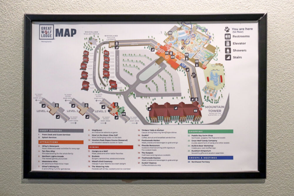 A framed map of the Great Wolf Lodge Poconos resort showing levels and tower locations.